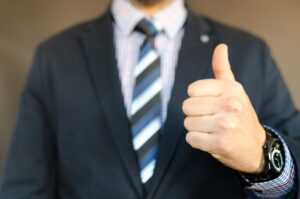 man giving a thumbs up, showing approval or satisfaction