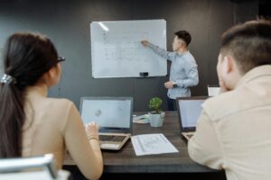 2 man and a woman in a meeting